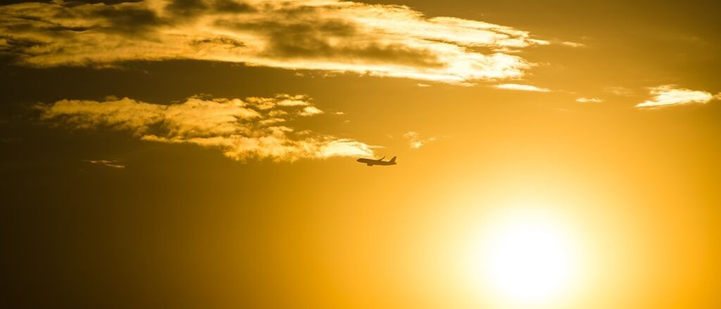 Plane in a sunset sky 2576091 960 720